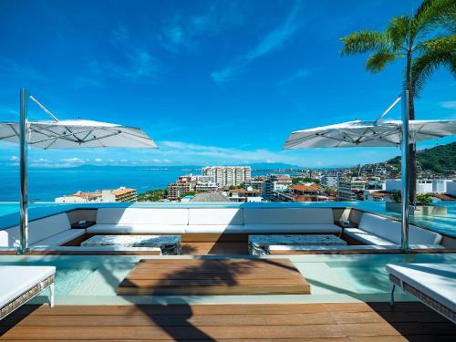 a view of the ocean from the roof of a building at PIER 57 - 211 Luxurious & Modern 1 BR Romantic Zone in Puerto Vallarta