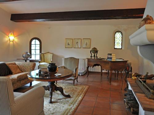 a living room with a table and a piano at Charming Villa in Callas with Private Swimming Pool in Callas