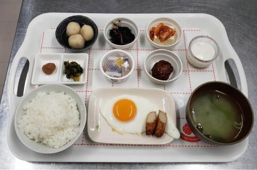 a tray of food with rice and eggs and other dishes at VistaMare in Kanoya