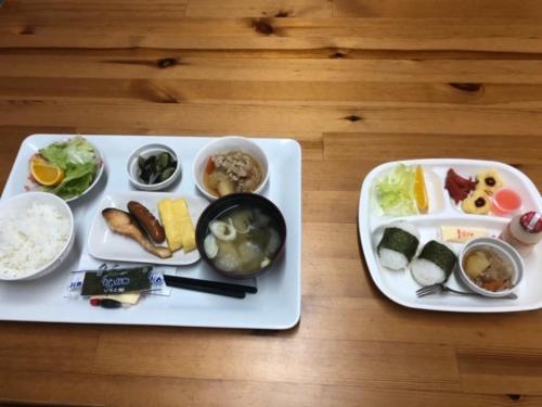 a table with two plates of food on a table at VistaMare in Kanoya