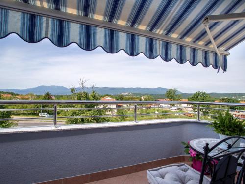 a balcony with a view of the mountains at Modern Apartment in Vi kovo with Balcony in Viskovo