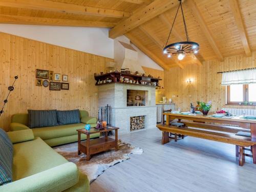 a living room with a couch and a fireplace at Apartment in Istria with Nature Views in Cerovlje