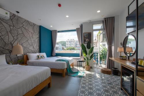 Postel nebo postele na pokoji v ubytování Shoho Hotel Nha Trang