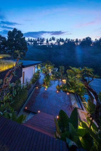 an overhead view of a deck with lights on it at Zenubud in Ubud