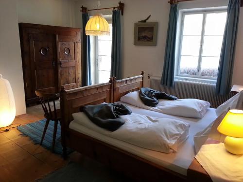 two beds in a bedroom with two pillows on them at Gasthof Simony Hallstatt B&B in Hallstatt