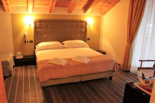 Säng eller sängar i ett rum på Hotel Nordend