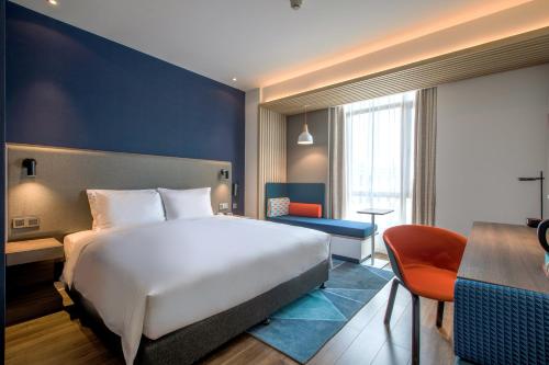 Katil atau katil-katil dalam bilik di Holiday Inn Express Zhangjiagang Free Trade Zone by IHG