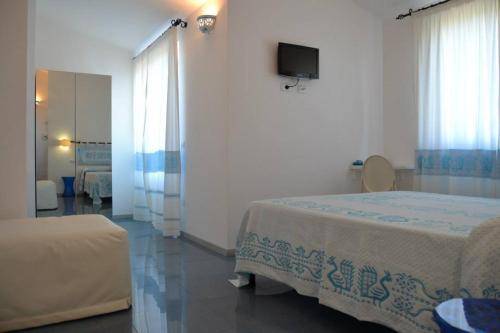 Ένα ή περισσότερα κρεβάτια σε δωμάτιο στο Villa Pischinas
