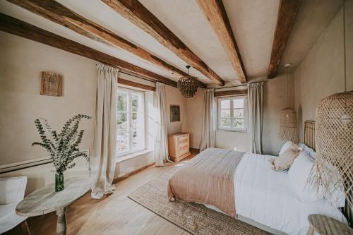 a bedroom with a bed and a large window at Luxury estate with 6 hectares land near hilltop town Motovun in Kaldir