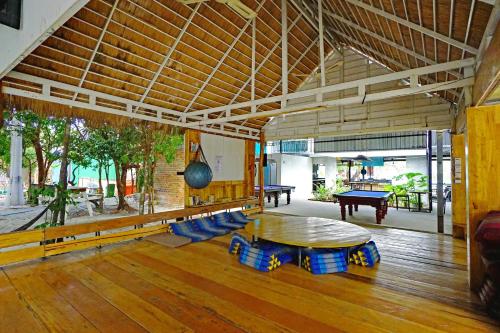 a large room with a table and a pool table at Onederz Koh Rong Sanloem in Koh Rong Sanloem