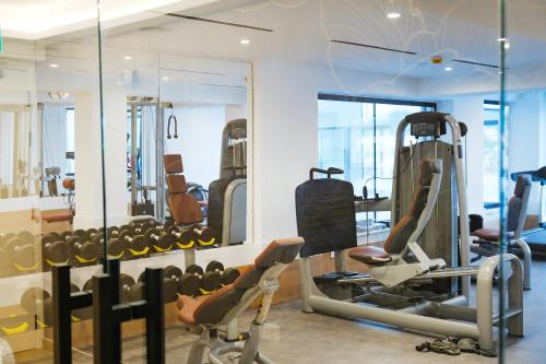 a gym with treadmills and elliptical machines at At Herbal Boutique Hotel & Spa in Protaras