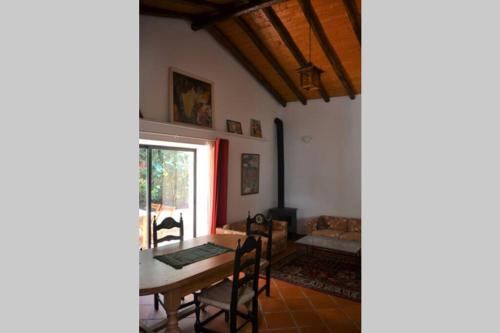 a living room with a table and a couch at Garden in the City in Silves