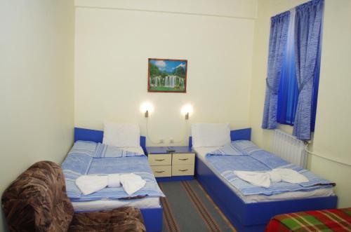 Кровать или кровати в номере Edi Hotel