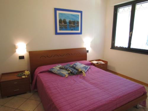 A bed or beds in a room at Villaggio Ducale 012