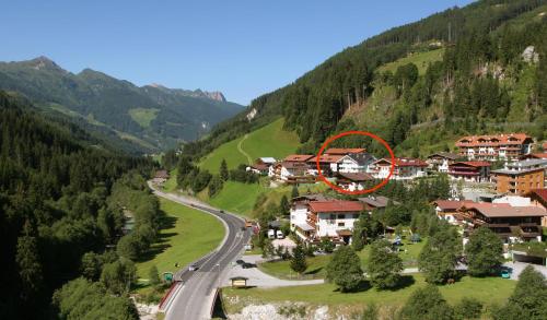 a village in the mountains with a red circle at Apartments Kolmblick in Gerlos