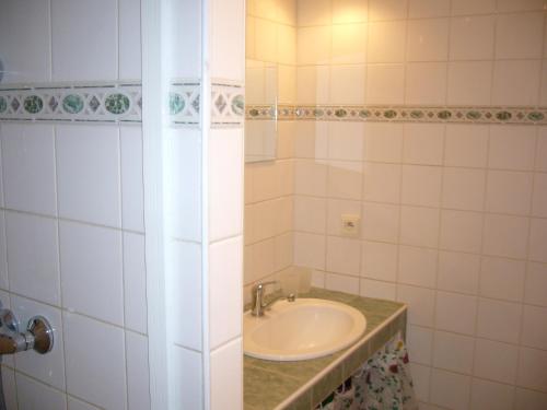 a bathroom with a sink and a shower at Chata Ala in Demanovska Dolina