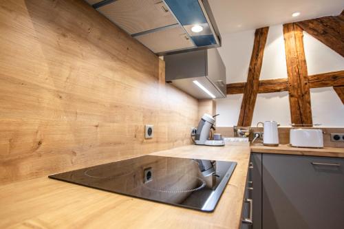 a kitchen with a sink and a counter top at Gîte La Rodernelle - Sauna - Patio - Climatisation - Vue sur Château du Haut Kœnigsbourg in Rodern