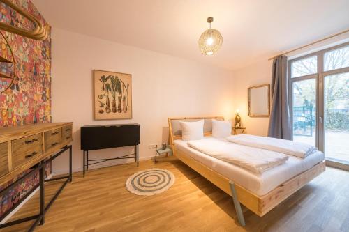 Кровать или кровати в номере Design Apartments - "Am Weinberg"