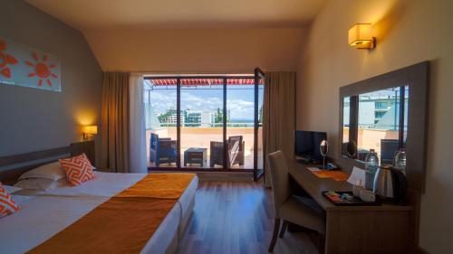 Postel nebo postele na pokoji v ubytování Park Hotel Odessos - All Inclusive