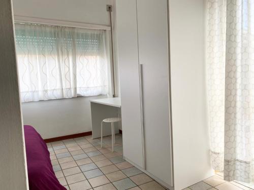 a room with a white cabinet and a window at Il Viaggiatore Serapo in Gaeta