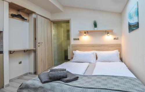 Posteľ alebo postele v izbe v ubytovaní For You Apartmanok
