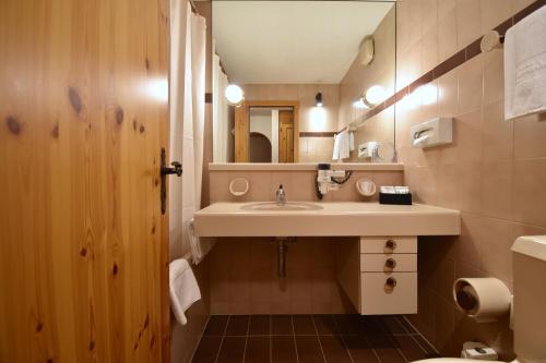 Koupelna v ubytování Hotel Laaxerhof