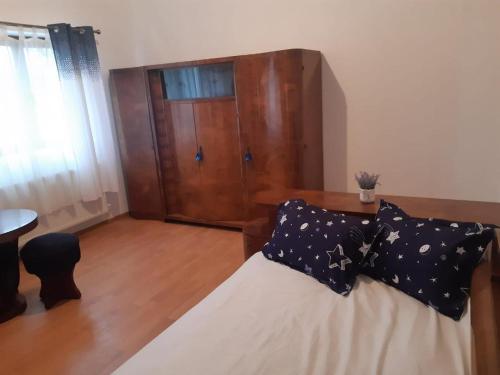 Postel nebo postele na pokoji v ubytování PENSIUNEA DODO