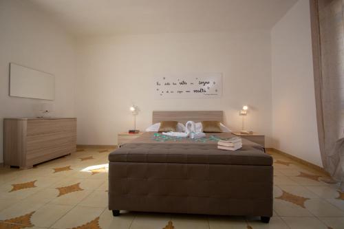 Ένα ή περισσότερα κρεβάτια σε δωμάτιο στο VILLA SALINA MONACI