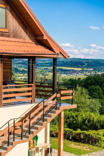 a stairway leading up to a house with a view at Willa Sulimówka - Noclegi Zakliczyn dom basen bania sauna SPA in Zakliczyn