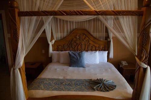 En eller flere senger på et rom på Hotel El Rebozo