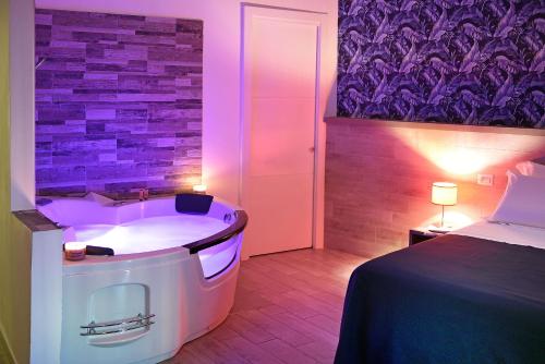 Postel nebo postele na pokoji v ubytování Barbarella Spa