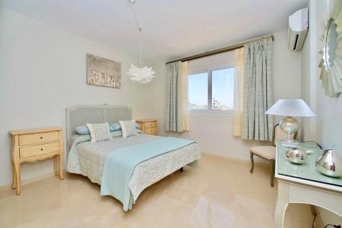a bedroom with a bed and a desk and a window at 3 Bed House - Sleeps 6 - Pool - Garden - Parking in Atamaría