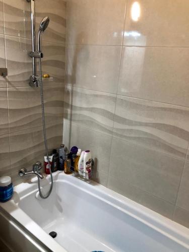 a bathroom with a shower and a bath tub at GOOD MOOD in Bragadiru