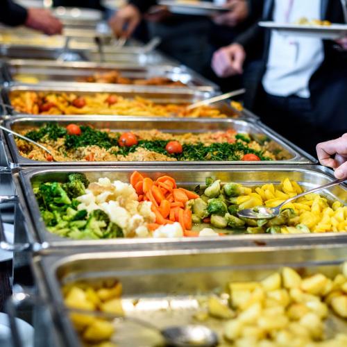 a buffet line with many trays of different foods at Grand Milano Hotel in Ayvalık