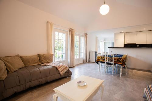 a living room with a couch and a table at Fonte Velha in Castelões- Penafiel