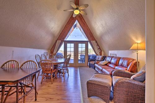 a living room with a couch and a table at Big Family Fun! Mtn Cabin Between Bryce and Zion in Long Valley Junction