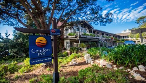 a sign for a comfort inn in front of a house at Comfort Inn Carmel By the Sea in Carmel