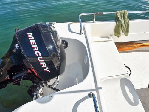 a cooler on the side of a boat in the water at 6 person holiday home in Farstad-By Traum in Farstad