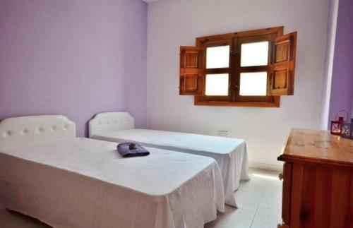 A bed or beds in a room at Mellieha Holiday Apartment 1