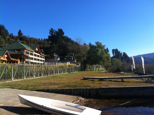 a surfboard sitting on the ground next to a building at Departamento Lago Vichuquen in Lago Vichuquen