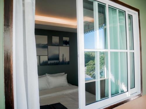 En eller flere senge i et værelse på VarietyD-DayHostel HuaHin