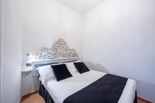 Postel nebo postele na pokoji v ubytování Residenza Florentia
