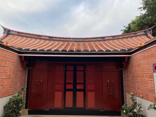 a red brick building with a red roof at The Chen Story II in Jincheng