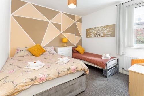 Łóżko lub łóżka w pokoju w obiekcie 44 Stonehill Street