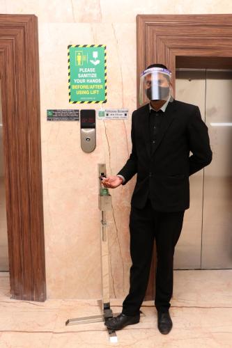 a man wearing a gas mask standing next to a wall at Hotel Le Roi,Haridwar@Har Ki Pauri in Haridwār