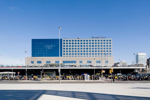 a large building with a lot of people in front of it at Barceló Sants in Barcelona