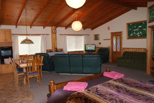 a living room with a couch and a table at AAA Granary Accommodation in Promised Land