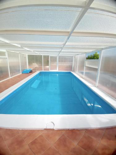 a large swimming pool in a house with a ceiling at Stefi in Candelaria