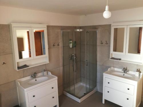 a bathroom with two sinks and a shower at Casa Martin , 4 bedroom villa in Bisenti