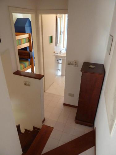 a hallway with a staircase leading to a room at Villaggio Estate in Lignano Sabbiadoro